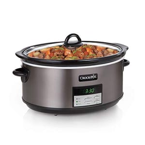 A stainless steel Crock-Pot with a digital display and control panel for setting cooking times and temperatures, featuring a black lid and handles.