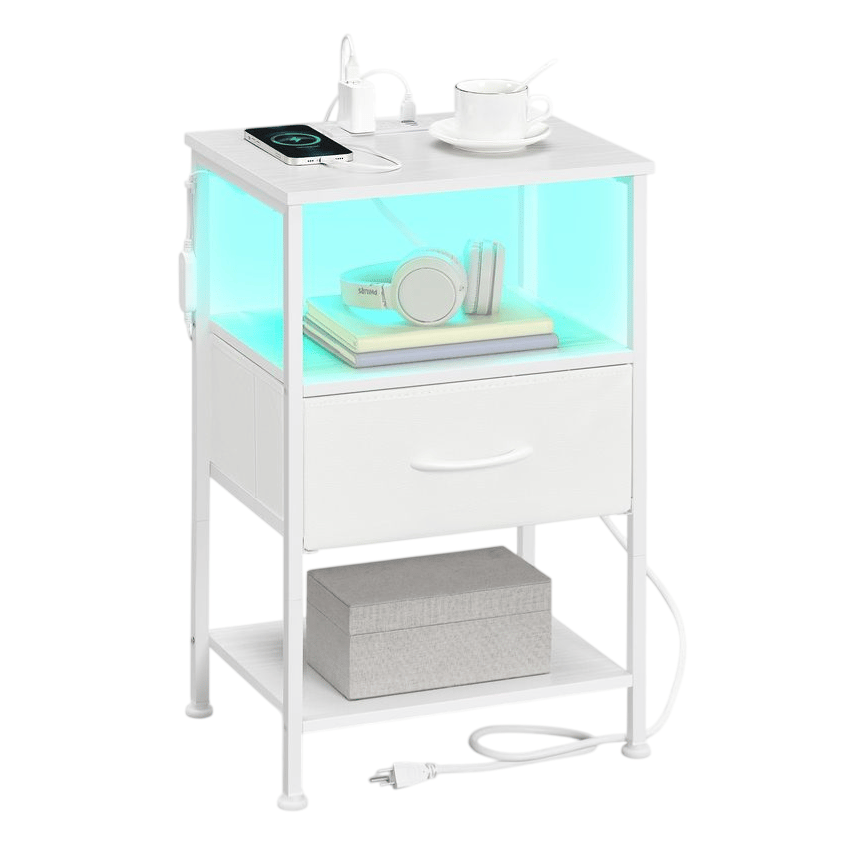 White modern nightstand with a glowing shelf, featuring a wireless charging pad, a mug, and headphones on books. It includes a drawer, a bottom shelf with a box, and power outlets with a cable.