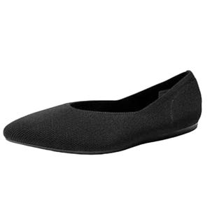 A black, textured ballet flat with a minimalist design and rounded toe.