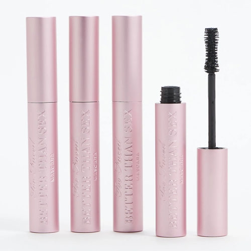 four pink tubes of mascara on a white background