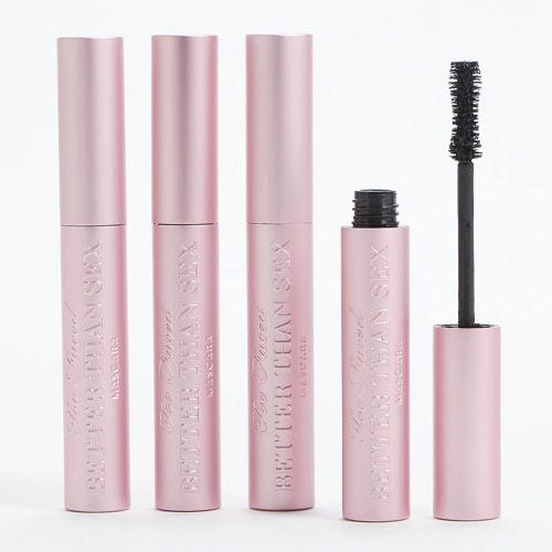 four pink tubes of mascara on a white background