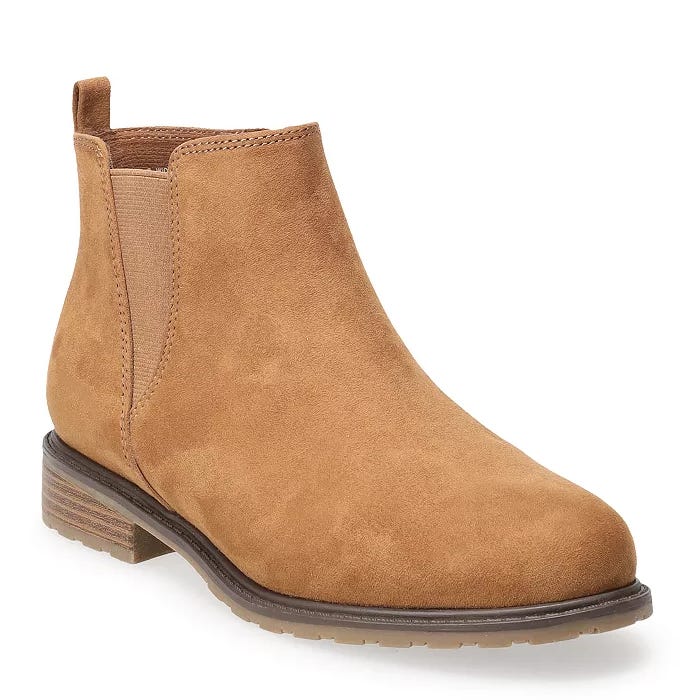 Tan suede Chelsea boots with elastic side panels, a pull-tab at the back, and a low stacked heel.