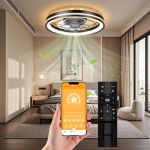 A modern low-profile LED ceiling fan with a circular design is installed in a bedroom. It features integrated lighting, can be controlled via a smartphone app and remote, and emits airflow depicted with animated green leaves.
