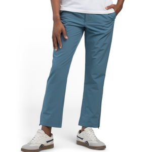 Blue pants paired with white sneakers featuring a blue and red stripe detail.
