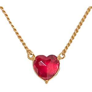 Gold-tone chain necklace with a heart-shaped red cubic zirconia pendant.