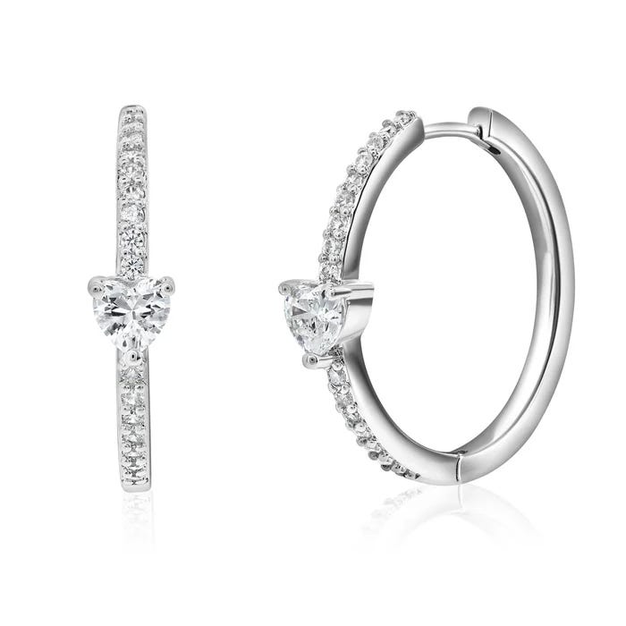 Silver hoop earrings featuring heart-shaped center stones and a row of smaller sparkling gems along the outer edge.