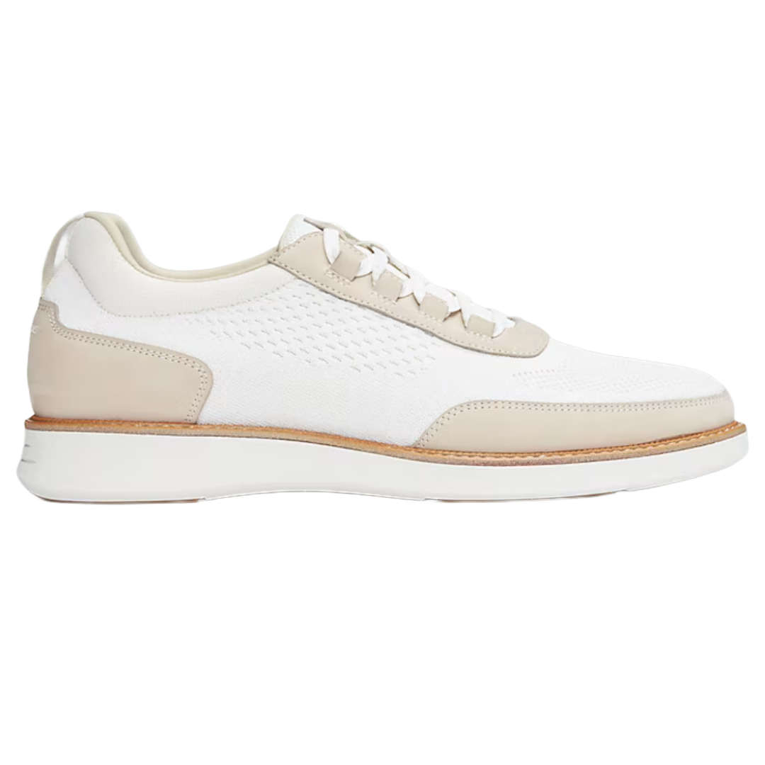 White and beige low-top sneaker with perforated details and a white sole, featuring beige leather accents and laces.