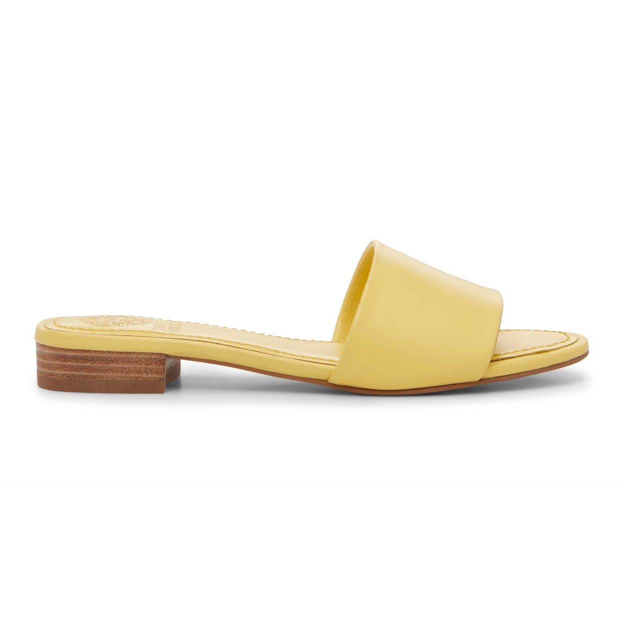 Yellow slide sandal with a wide strap, flat sole, and low stacked heel.