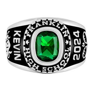 A class ring with a green gemstone, engraved with \“Kevin,\“ \“Franklin High School,\“ and the year \“2024.\“
