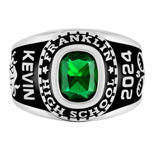 A class ring with a green gemstone, engraved with \“Kevin,\“ \“Franklin High School,\“ and the year \“2024.\“