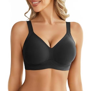 A black wireless push-up bra with smooth, seamless cups and wide straps, offering support and lift without underwires; features a V-neck design with a sleek, minimalist look.