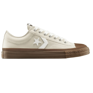Cream-colored low-top sneaker with white laces, a brown sole, and a white star and chevron logo on the side.