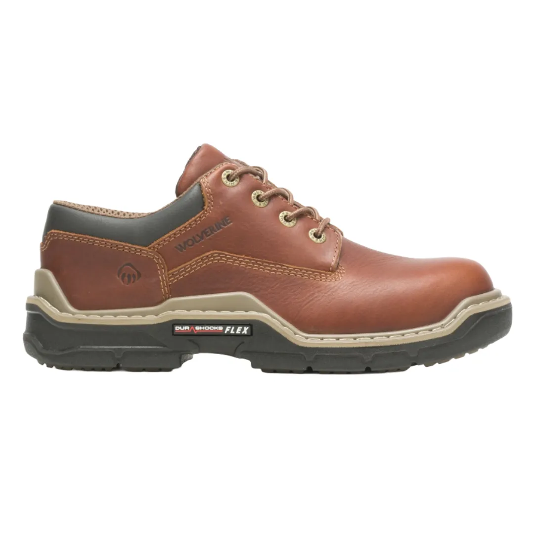 Brown leather work shoe with a black sole, labeled \“Wolverine\“ with \“DuraShocks Flex\“ technology.