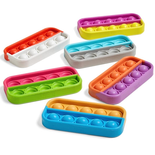 Colorful silicone ice cube trays in various bright colors, each with a different number of round compartments for ice-making.
