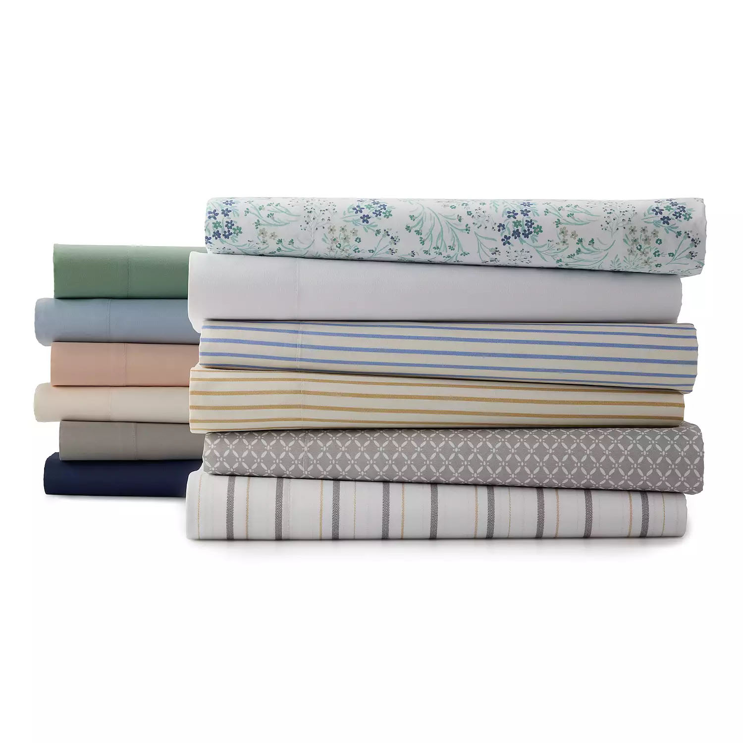 A stack of folded fabric, including various solid colors and patterned designs.