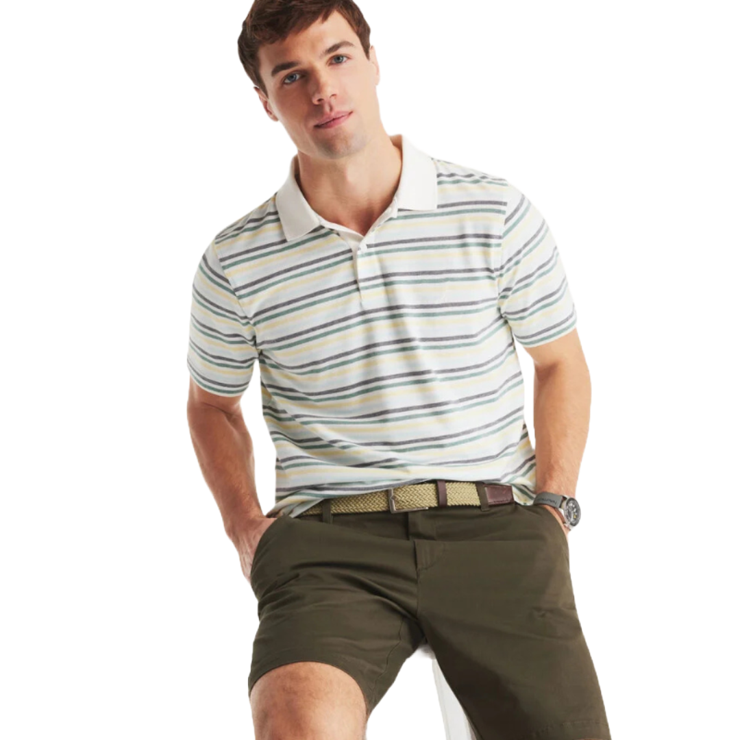 A man is wearing a striped polo shirt and olive green shorts, accessorized with a braided belt and watch.