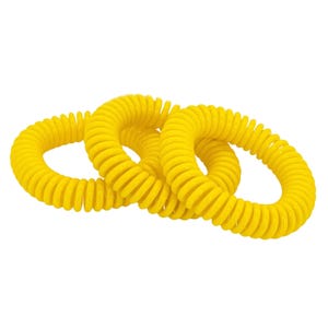 Three yellow coiled plastic wristbands, commonly used as mosquito repellent bands.