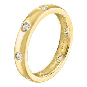 Gold wedding band with a polished finish, featuring evenly spaced white diamonds set in recessed round settings around the band.