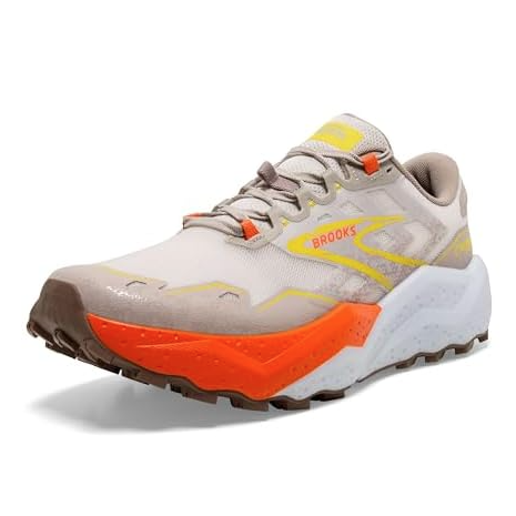 A trail running shoe featuring a beige upper with orange and yellow accents, rugged outsole for grip, and a cushioned midsole for comfort.