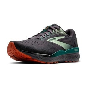 Brooks running shoe in dark gray with green accents and an orange sole, featuring the brand's logo on the side.