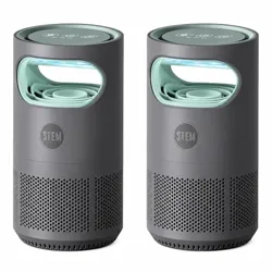 Two cylindrical air purifiers with a dark gray body and light green accents, featuring perforated designs near the base and an LED display on top.