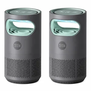 Two cylindrical air purifiers with a dark gray body and light green accents, featuring perforated designs near the base and an LED display on top.