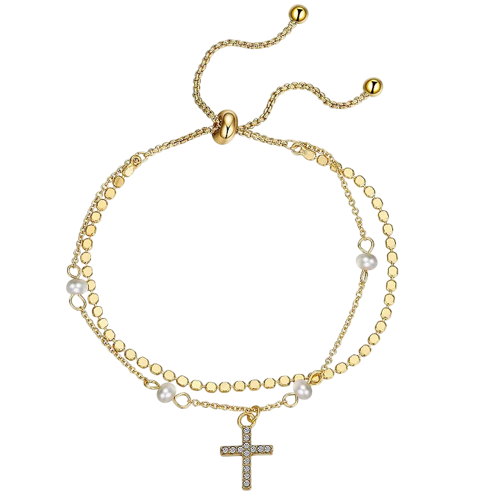 Gold-tone adjustable bracelet with a dual-chain design, featuring a cross charm adorned with crystals and interspersed with pearls.