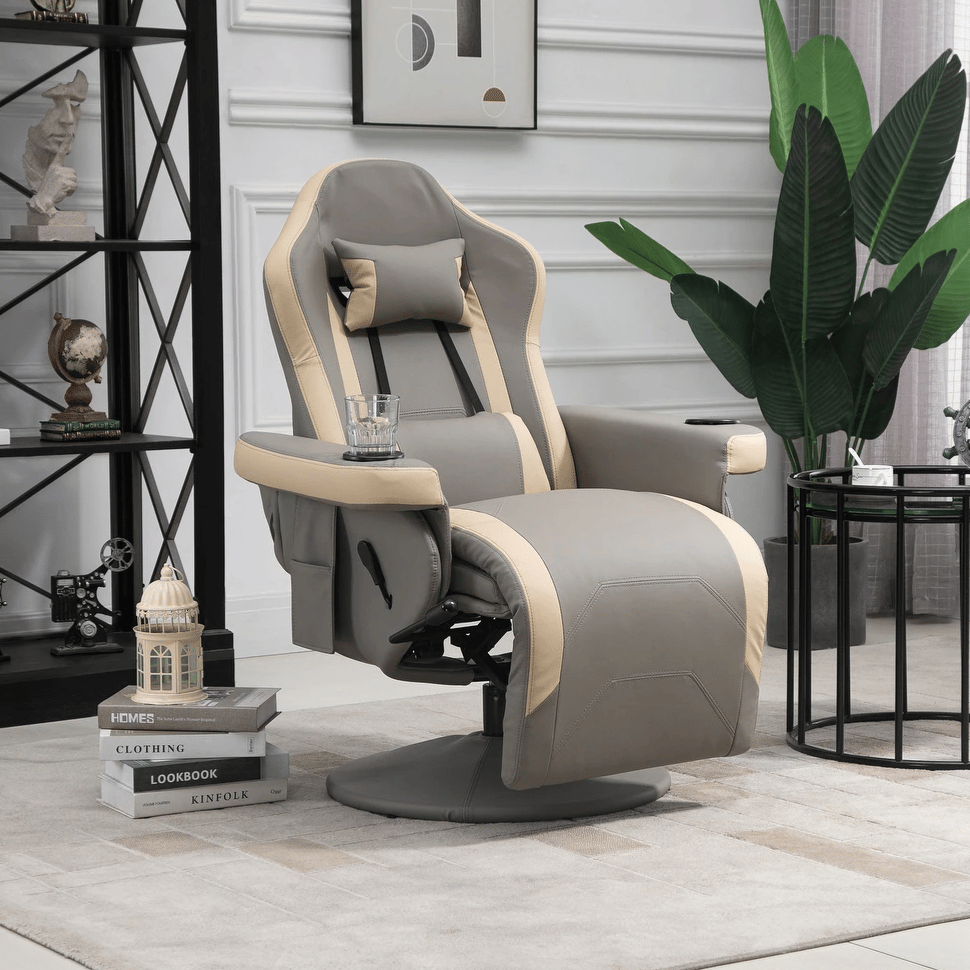 A plush, gray and beige recliner with a headrest, cup holder, and footrest is situated in a modern living room setting, featuring a decorative plant, wall art, and a sleek black shelf with decorative items.