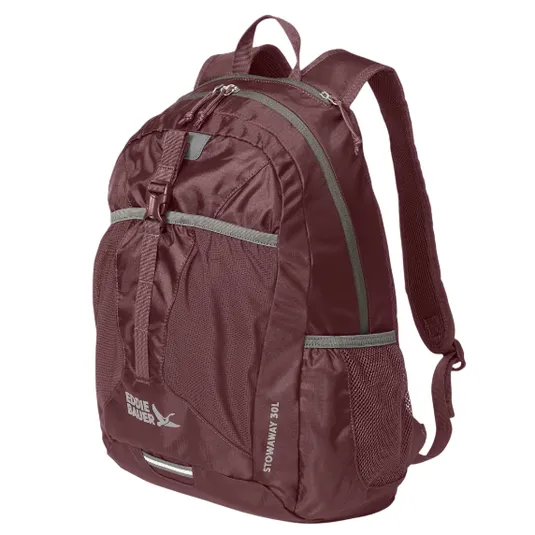 A burgundy Eddie Bauer Stowaway 30L backpack with multiple compartments, front buckle strap, and mesh side pockets.