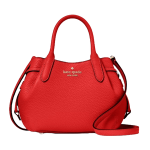 Red Kate Spade New York handbag with a pebble leather texture, dual top handles, and an adjustable shoulder strap.