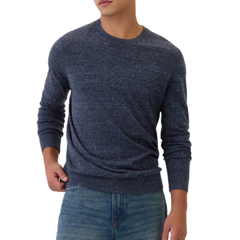 A navy blue speckled crewneck sweater with long sleeves, paired with blue jeans. The sweater has a fitted style with ribbed cuffs and hem.