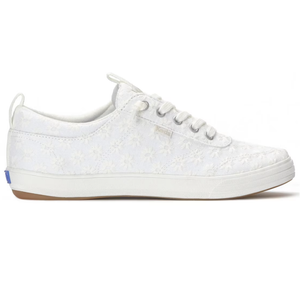 White low-top sneaker with floral lace overlay, featuring lace-up design and rubber sole.