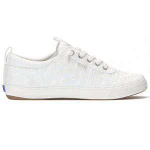 White low-top sneaker with floral lace overlay, featuring lace-up design and rubber sole.