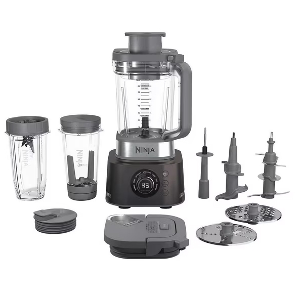 The Ninja Ultimate Blender System includes a blender base with a large blending jar, two personal-size cups with lids, various blade attachments, a food processor lid, and slicing/shredding discs.