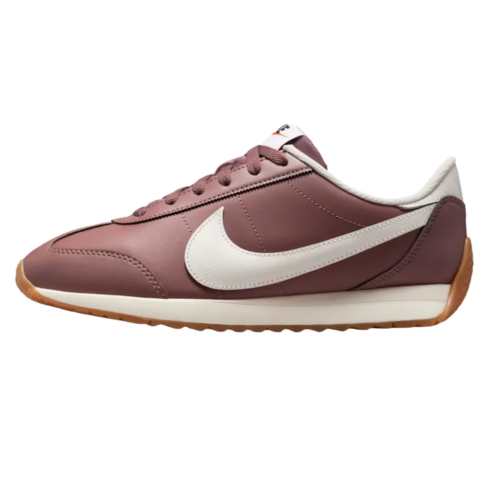 A maroon Nike sneaker with a white swoosh, white midsole, and gum sole, featuring a low-cut design and matching maroon laces.