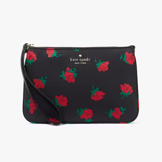 A black wristlet with red rose patterns and the \“kate spade new york\“ logo.