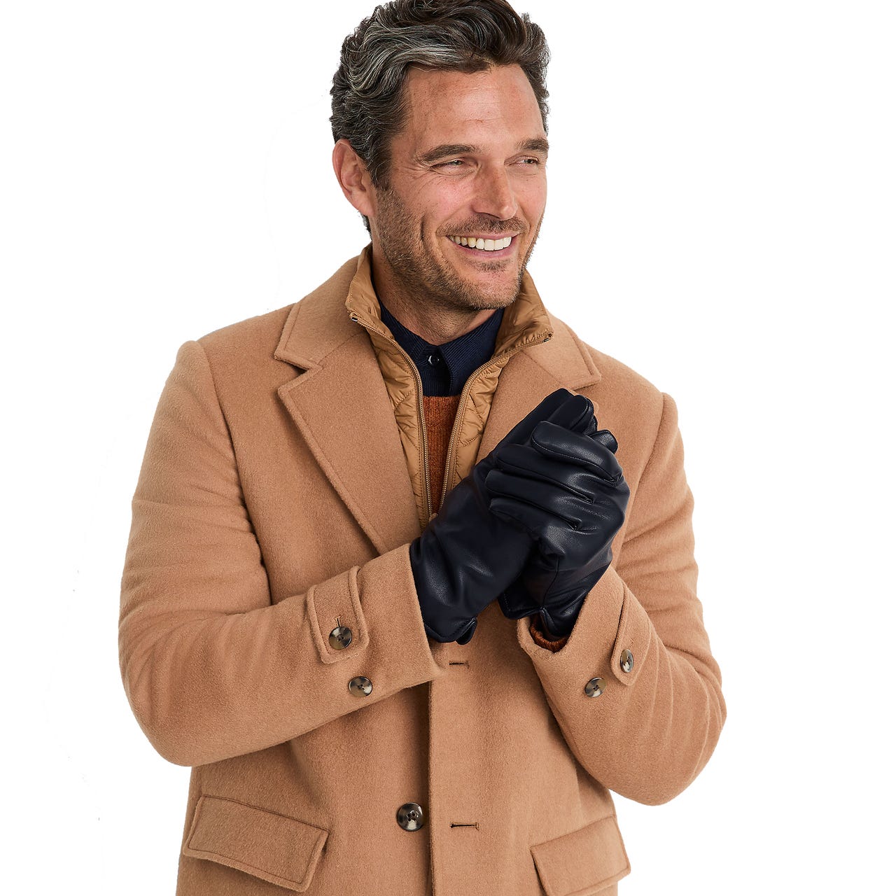 Men's black faux leather gloves with a sleek finish and warm lining, worn by a person dressed in a camel-colored coat.