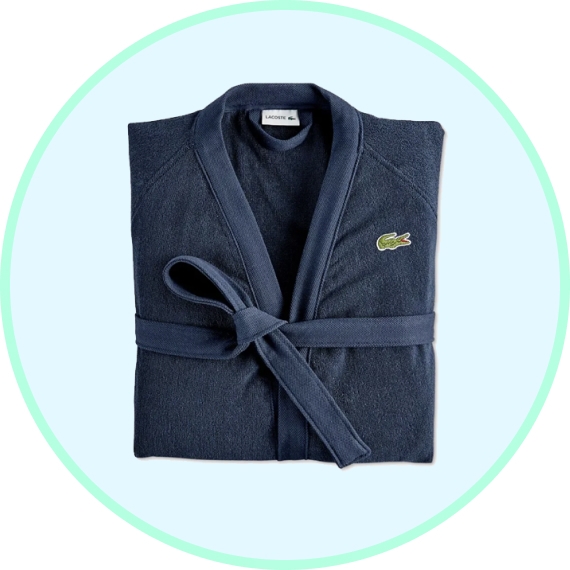 A dark blue bathrobe with a belt and a small green crocodile logo on the chest.