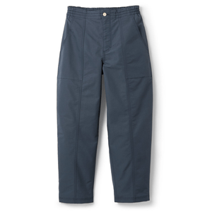 A pair of dark blue relaxed-fit pants with an elastic waistband, button closure, and side pockets, featuring prominent seam detailing.