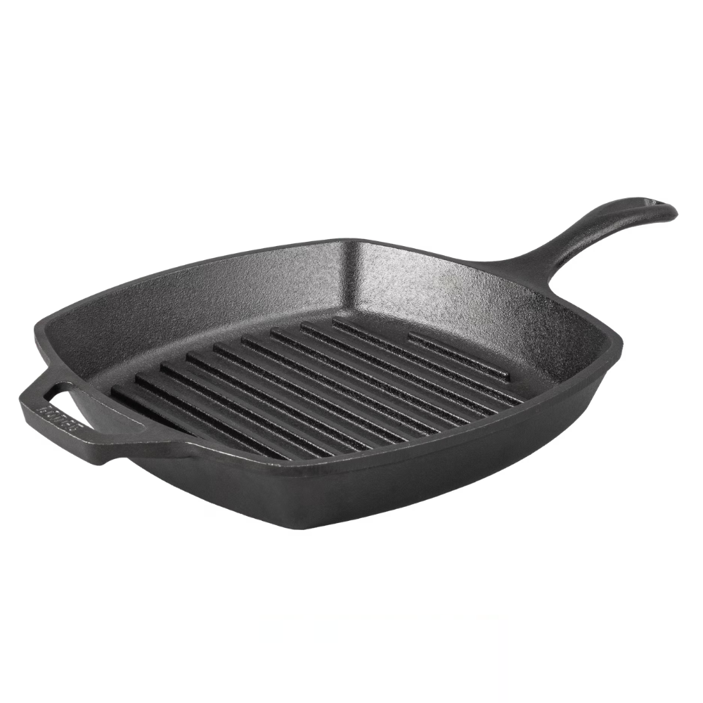 A square cast iron grill pan with ridges, featuring a long handle and helper handle, designed for grilling and searing foods.