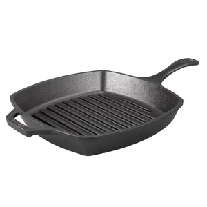 A square cast iron grill pan with ridges, featuring a long handle and helper handle, designed for grilling and searing foods.