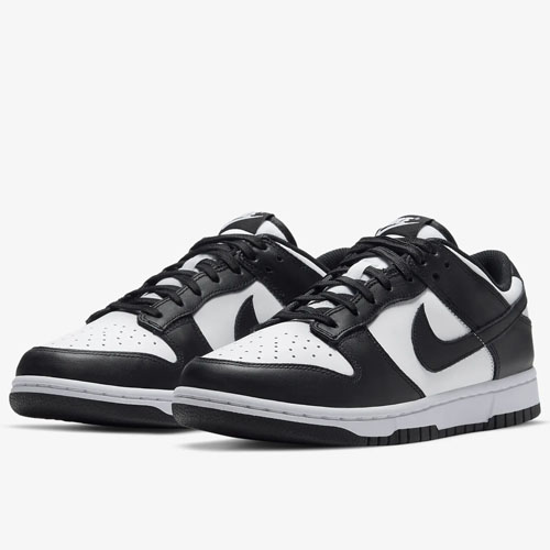 A pair of black and white sneakers with a swoosh logo on the side.