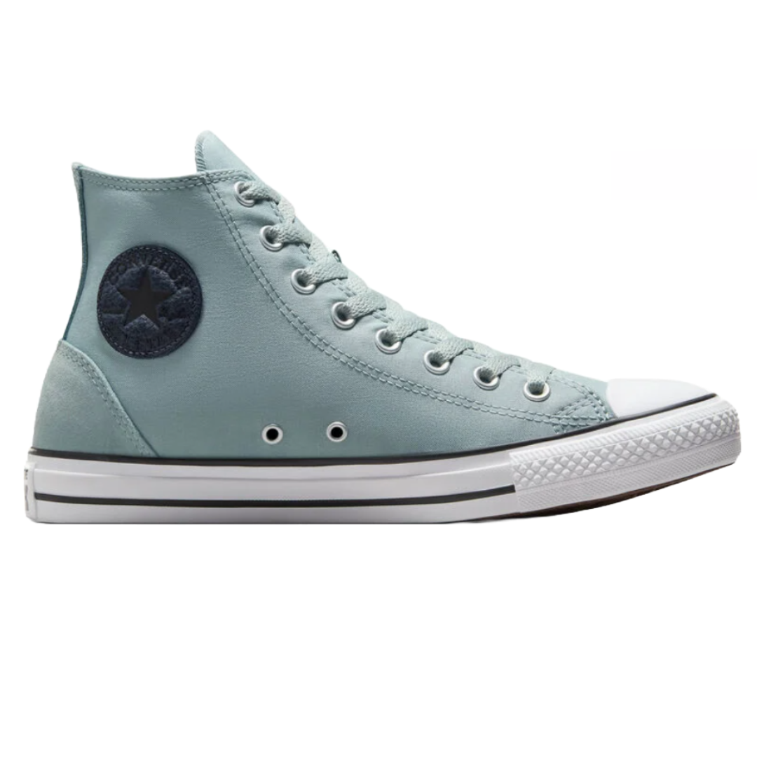 Light blue high-top Converse Chuck Taylor sneakers featuring a round black star patch, white rubber toe cap, metal eyelets, and a vulcanized rubber sole with black stripes.