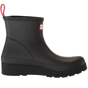 A black ankle-high rubber boot with a wedge heel and a red pull tab. It features a brand label on the side.