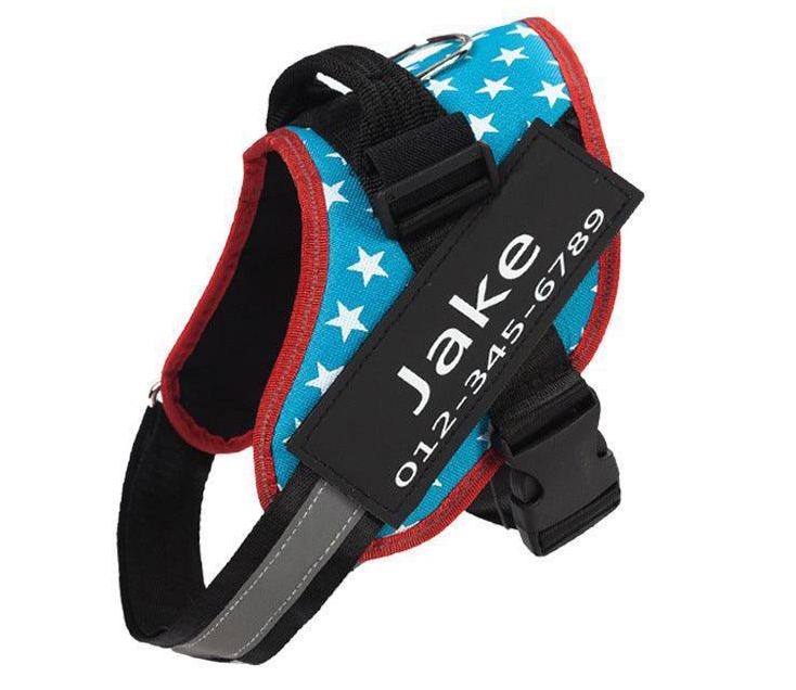 Dog harness with a star pattern, featuring a customizable patch displaying the name \“Jake\“ and a phone number.