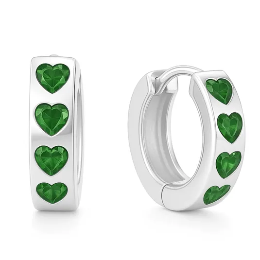 Silver hoop earrings with embedded green heart-shaped stones.