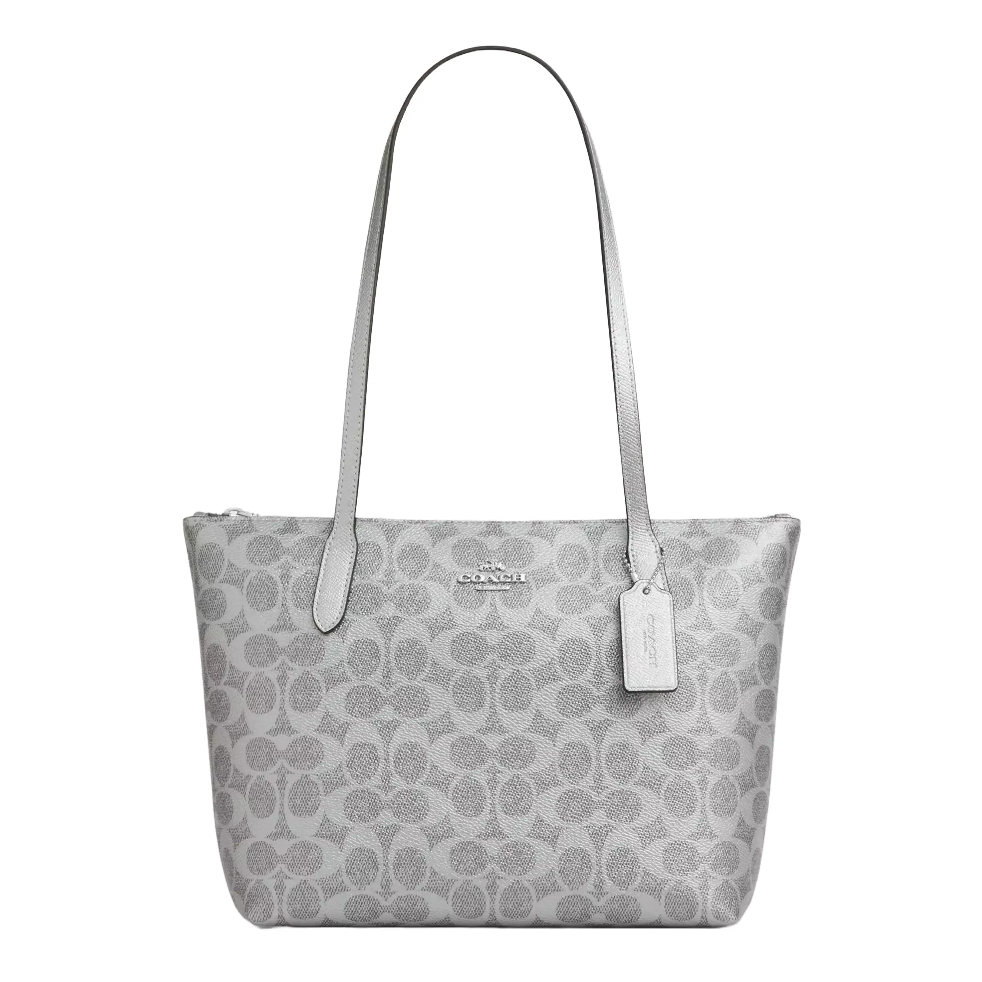 A gray Coach tote bag with the signature 'C' pattern, featuring long handles and a brand tag attached.