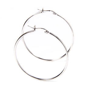 A pair of simple, silver hoop earrings with a thin, circular design and a latch back closure.