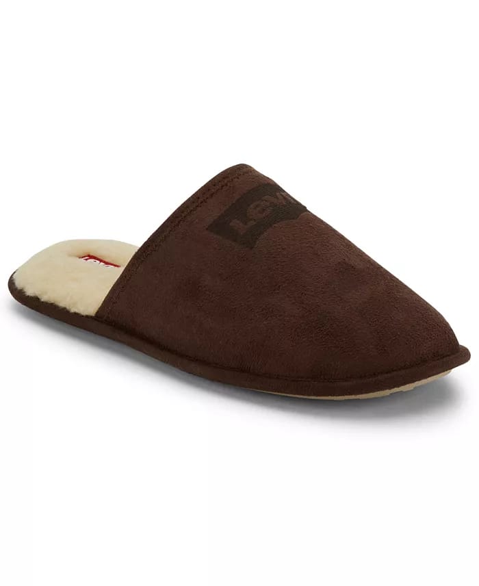 A brown slip-on slipper with a faux fur lining and a logo on the side.