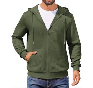 Olive green zip-up hoodie with a subtle geometric pattern, featuring a drawstring hood, front pockets, and ribbed cuffs, paired with blue jeans.